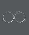 Classic hoops with an extra kick. Earrings have been hammered for a rustic, textured look. Flat sterling silver setting. Approximate diameter: 1-1/3 inches.