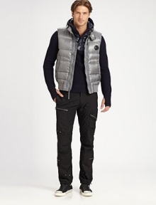 Sleek nylon and silvertone hardware give this down puffer vest a sporty, contemporary edge.Stand collarZip-front with snap flap closureSleevelessSnap slash side pocketsNylonFill: 80% down/20% other feathersMachine washImported Sleek nylon and silvertone hardware give this down puffer vest a sporty, contemporary edge.Stand collarZip-front with snap flap closureSleevelessSnap slash side pocketsNylonFill: 80% down/20% other feathersMachine washImported
