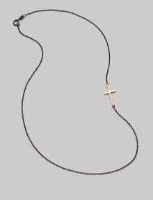 A gleaming 14K gold cross on an oxidized silver chain.14K gold Oxidized sterling silver Length, about 16 Pendant length, about ¾ Lobster clasp closure Made in USA A gleaming 14K gold cross on an oxidized silver chain.14K gold Oxidized sterling silver Length, about 16 Pendant length, about ¾ Lobster clasp closure Made in USA