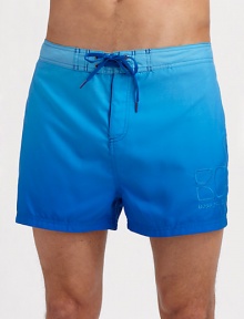 A shorter, classic fit made for sunny beachside days with quick-dry comfort and gently fading color. Drawstring waist Embroidered logo detail Mesh lining Inseam, about 4 Polyester Machine wash Imported 