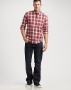 A relaxed fit with modern sensibilities, rendered with embroidered back flap pockets and dark, gently faded denim. Five-pocket style Signature stitching on back pockets Inseam, about 34 Cotton Machine wash Made in USA 