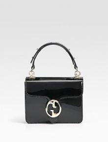 Luxe patent leather with gusset construction, finished with a double G closure.Adjustable handle with G-shaped link accents, 4 drop Double G closure Removable engraved logo mirror with leather case Inside zip, snap, and open pockets Leather lining 7W X 6¼H X 2½D Made in Italy