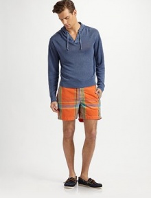 Relaxed swim trunks in a quick-drying blend of cotton and nylon with an easy fit thanks to an elastic back waistband. Shoestring waist Velcro® fly Side slash, back patch pockets Interior waistband key pocket Embroidered logo detail Mesh lining Inseam, about 6 52% cotton/48% nylon Machine wash Imported 