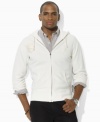 Tonal embroidered details imbue this weathered fleece hoodie with vintage character and athletic style.