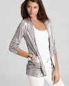 This shimmery GUESS blazer lends a major dose of glam to every look, from weekend basics to after-dark frocks.