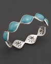 Sky blue enamel drops over a carved sterling silver bangle By Elizabeth Showers.