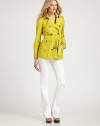 Colorful and chic, tailored with military-inspired details.Point collarButton-down gunflapsDouble-breasted button frontSelf beltSide zipper pocketsBelted cuffsBack button-down rainflapBack rivet details and hemline ventAbout 23 from shoulder to hem49% cotton/45% polyester/6% metallic threadDry cleanImportedModel shown is 5'10½ (179cm) wearing US size 4. 