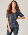 Add romance to your favorite jeans with this petite top from DKNY Jeans, featuring mini pleats, a vintage-inspired floral print and a chic tie waist.