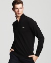 Preppy-meets-modern with a classic half-zip cotton sweater from Lacoste.