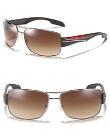 Sleek modern design make these navigator sunglasses simply irresistible. With graphic arms and double bridge design.