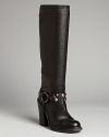 Vera Wang Lavender Label lends refined tall boots a bit of rocker edge-when the mood strikes-in the form of removable studded harnesses. Wear these basic black boots to work, slip the studs on after hours.