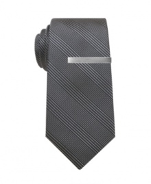 Add some dimension. This Alfani skinny tie has a plaid design that adds another level to your already stellar style. Tie bar included. Add some dimension. This Alfani skinny tie has a plaid design that adds another level to your already stellar style. Tie bar included.