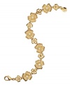 Petal pusher. A pretty floral pattern stands out on this beautiful flex bracelet from Monet. Made in gold tone mixed metal, it's embellished with sparkling glass and cubic zirconia accents. Approximate length: 7-1/2 inches.