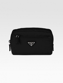 Bright colored nylon design with logo detail and leather accents.Top zip closure One outside zip pocket One inside zip pocket Fully lined 8W X 5H X 2½D Made in Italy Bright colored nylon design with logo detail and leather accents.Top zip closure One outside zip pocket One inside zip pocket Fully lined 8W X 5H X 2½D Made in Italy