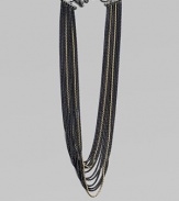 An edgy piece with a beautiful drape in 18k gold and blackened sterling silver box link chains. 18K goldBlackened sterling silverLength, about 18Toggle closureImported 
