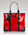 The tote bag goes glossy. kate spade new york gives its daytime classic a high-shine update with patent leather and travel-ready trims.