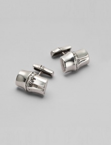 An artful interpretation of bamboo, created in sterling silver. Chunky cuff links with etched detailing Made in Bali An artful interpretation of bamboo, created in sterling silver. Chunky cuff links with etched detailing Made in Bali