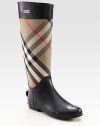 Classic canvas check print rain boot, finished with jersey lining and an exposed back zipper. Shaft, 15Leg circumference, 16Canvas and rubber upperExposed back zipperJersey liningRubber solePadded insoleImportedOUR FIT MODEL RECOMMENDS ordering true whole size; ½ sizes should order the next whole size up. 