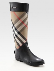 Classic canvas check print rain boot, finished with jersey lining and an exposed back zipper. Shaft, 15Leg circumference, 16Canvas and rubber upperExposed back zipperJersey liningRubber solePadded insoleImportedOUR FIT MODEL RECOMMENDS ordering true whole size; ½ sizes should order the next whole size up. 