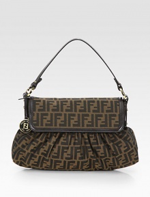 Iconic signature jacquard accented with luxuriously smooth leather trim.Double leather top handles, 7 dropMagnetic snap flap closureOne inside zip pocketCotton lining15W X 9H X 3DMade in Italy Iconic signature jacquard accented with luxuriously smooth leather trim.Double leather top handles, 7 dropMagnetic snap flap closureOne inside zip pocketCotton lining15W X 9H X 3DMade in Italy