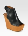 Elevate your look with a leather slide that features an adjustable slingback strap and chunky wedge. Self-covered wedge, 5 (125mm)Covered platform, 1 (25mm)Compares to a 4 heel (100mm)Leather upperLeather lining and solePadded insoleMade in ItalyOUR FIT MODEL RECOMMENDS ordering true size. 