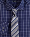 An elegant mix of stripes sharpen a classic silk tie woven in Italy. About 3 wideSilkDry cleanMade in Italy