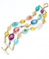 Amp up your look with a vibrant accessory. Lauren by Ralph Lauren's multicolored three-row bracelet highlights reconstituted semi-precious turquoise and glass beads. Set in gold tone mixed metal. Approximate length: 7-1/2 inches.