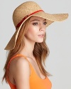 Juicy Couture's woven straw floppy hat with a contrast red patent band and bow detail for a ladylike touch.