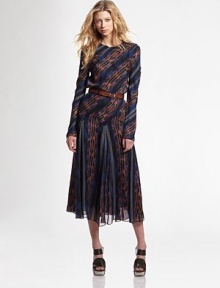 A lush silk print with spiral seaming giving way to a full, softly pleated skirt.Round neckline Long sleeves Point detail below waist Silk lining About 35 from natural waist Silk Dry clean Imported of Italian fabric A lush silk print with spiral seaming giving way to a full, softly pleated skirt.Round neckline Long sleeves Point detail below waist Silk lining About 35 from natural waist Silk Dry clean Imported of Italian fabric