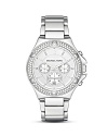 Glittering Swarovski crystals lend luxe shine to this elegant, modern timepiece from MICHAEL Michael Kors.