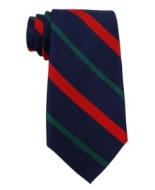 Tommy Hilfiger elevates a sporty look to a sophisticated new standard with this striped silk tie. Tommy Hilfiger elevates a sporty look to a sophisticated new standard with this striped silk tie.