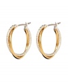 Chic hoops with double the versatility. Monet earrings feature gold tone and silver tone mixed metal twisted together into one stylish hoop. Approximate diameter: 7/8 inch.