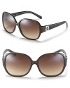 Chic oversized glasses with signature logo embellishment at temples from Tory Burch.