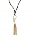 Slip into something new. Jessica Simpson's necklace is crafted from gold-tone mixed metal with a stylish tassel pendant. A snake motif adorns the black chord for a bit of an edge. Approximate length: 28 inches + 6-inch drop.