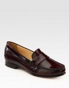 Slip on this preppy favorite rendered in fine leather with a hint of sheen. Leather upperLeather liningLeather and rubber solePadded insoleImported