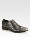 A traditional wingtip and perforated details top this burnished leather favorite with a subtle hint of sheen. Stacked heel, 1¼ (30mm)Leather upperLeather liningLeather and rubber solePadded insoleMade in Italy