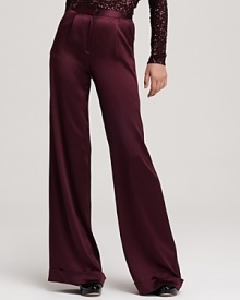 In a regal plum hue and classic cut, these wide leg Alice + Olivia high waisted pants exude easy elegance. A ladylike sequin blouse infuses the look with retro-inspired glamour.