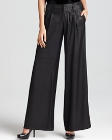 A dramatic wide leg silhouette emboldens these shimmering Alice + Olivia metallic pants, featuring a thick waistband and ladylike pleats.