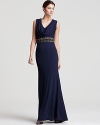 This Badgley Mischka gown evokes modern glamour with an opulent jeweled waist and elegant draped neck.