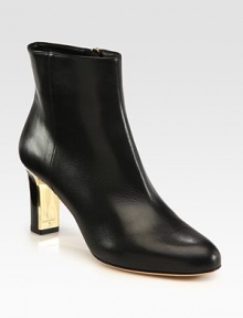 A sleek and sexy design of fine Italian leather with an unexpected goldtone heel. Stacked and lacquered heel, 2¾ (70mm)Leather upperSide zipLeather lining and solePadded insoleMade in ItalyOUR FIT MODEL RECOMMENDS ordering one half size up as this style runs small. 