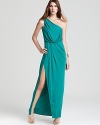 A modern iteration of Grecian-inspired glam, this BCBGMAXAZRIA one-shoulder gown flaunts a jewel-tone hue and thigh-high slit.