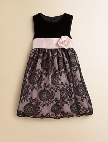 An elegant frock crafted in a sleeveless silhouette with a velvet bodice, floral detail and delicate lace skirt.Round necklineSleevelessBack buttonsWaistband with sash and flowerFull skirtPolyester tulleDry cleanImported of domestic fabric Please note: Number of buttons may vary depending on size ordered. An elegant frock crafted in a sleeveless silhouette with a velvet bodice, floral detail and delicate lace skirt.Round necklineSleevelessBack buttonsWaistband with sash and flowerFull skirtPolyester tulleDry cleanImported of domestic fabric Please note: Number of buttons may vary depending on size ordered.