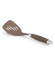 Totally turn things around in the kitchen! Food prep gets a precision edge with a sleek slotted bronze-hued turner that combines a silicone SureGrip handle and durable stainless steel for comfort and strength that bring even more meals to the table. Totally turn things around in the kitchen! Food prep gets a precision edge with a sleek slotted bronze-hued turner that combines a silicone SureGrip handle and durable stainless steel for comfort and strength that bring even more meals to the table.
