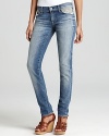 A heavily faded wash and embroidered pockets bring a rustic-chic aesthetic to these 7 For All Mankind skinny jeans.