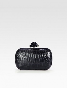 A classic style in rich crocodile accented with a chic knot detail.Top clasp closureSuede lining7½W X 4½H X 1½DMade in Italy A classic style in rich crocodile accented with a chic knot detail.Top clasp closureSuede lining7½W X 4½H X 1½DMade in Italy