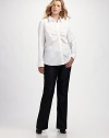 Strategically placed center ruching and a touch of stretch add flattering femininity to this well-tailored shirt. Shirt collar Front button placket with shirred details Three-quarter sleeves with button cuffs Back shoulder yoke Back princess seams Shirttail hem Italian cotton/nylon/lycra Dry clean Imported