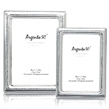 Argento hammered sterling silver frame. Dual easel for portrait and landscape tabletop display. Solid .925 fine sterling silver. Clear lacquered for tarnish free appearance. Argento hammered sterling silver frame. Dual easel for portrait and landscape tabletop display. Solid .925 fine sterling silver. Clear lacquered for tarnish free appearance.