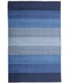 Hand-tufted, blended wool gives an exceptionally soft feel to this rug from the Coastal Treasures collection. In a shimmering, striped design of ocean-blue colorways, this sophisticated piece adds serene character to every decor.