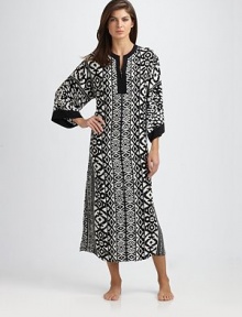 The coziest thing to wrap yourself in, in a soft knit with flattering pleats and dolman sleeves. Scoop neck with lace detail 48, shoulder to hem Lyocell; machine wash Imported The coziest thing to wrap yourself in, in a soft knit with flattering pleats and dolman sleeves. Scoop neck with lace detail 48, shoulder to hem Lyocell; machine wash Imported