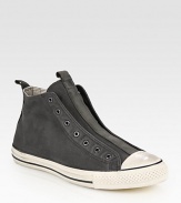 Canvas high-top design with a contrasting rubber toecap and sole, modernized by a laceless front. Leather liningPadded insoleRubber soleImported